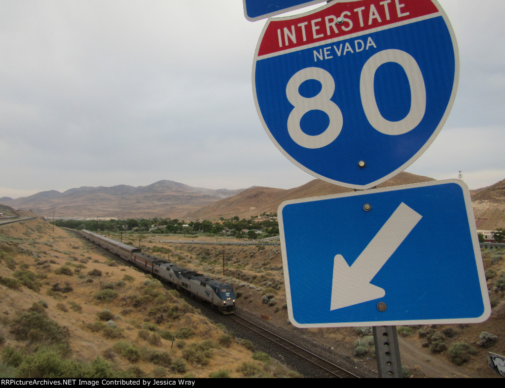 Trains and automobiles... no planes to be found in the shot.